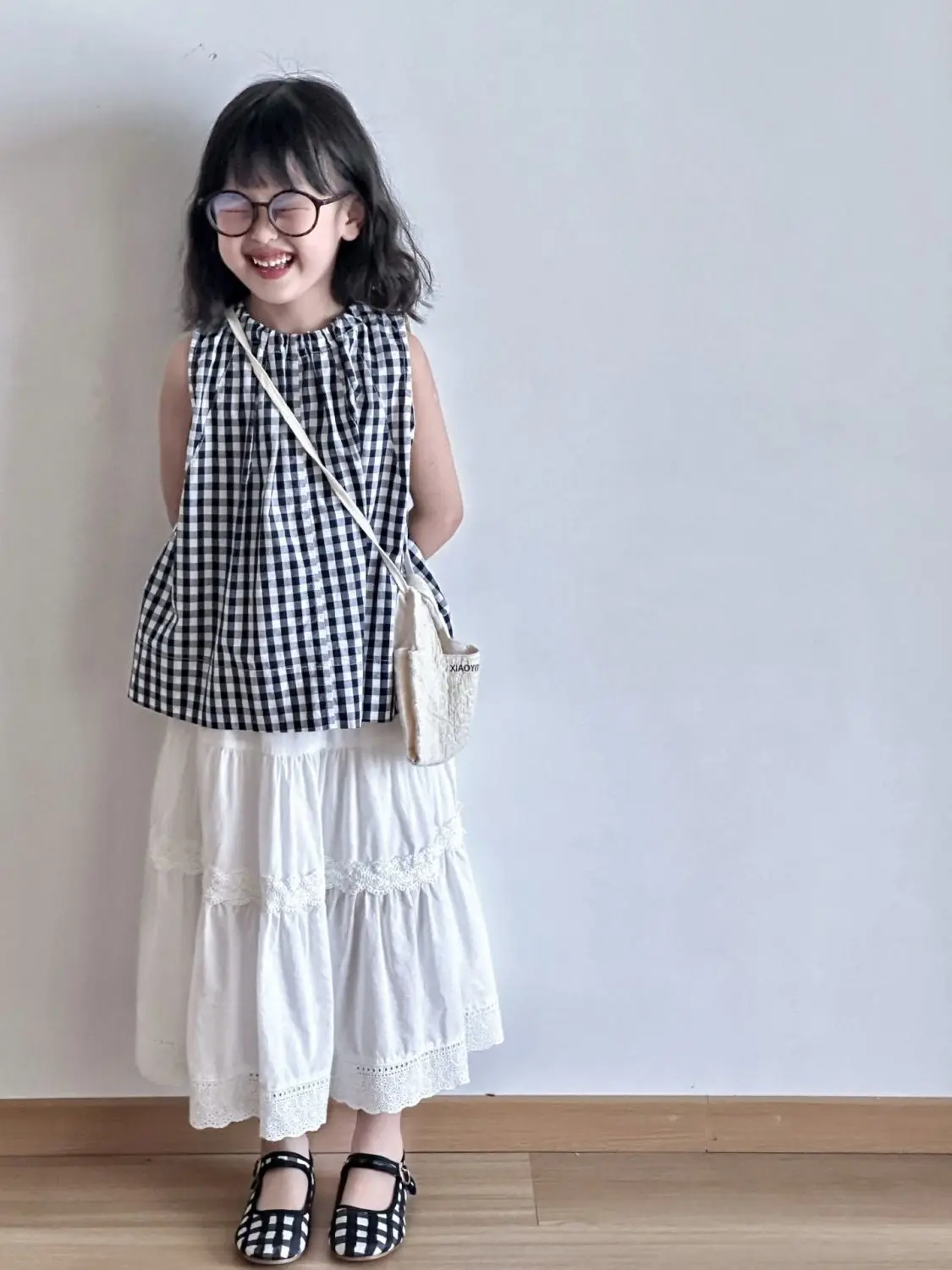 Summer girls' set fashion new children's cotton plaid sleeveless shirt+skirt two-piece set
Summer girls' set fashion new children's cotton plaid sleeveless shirt+skirt two-piece set