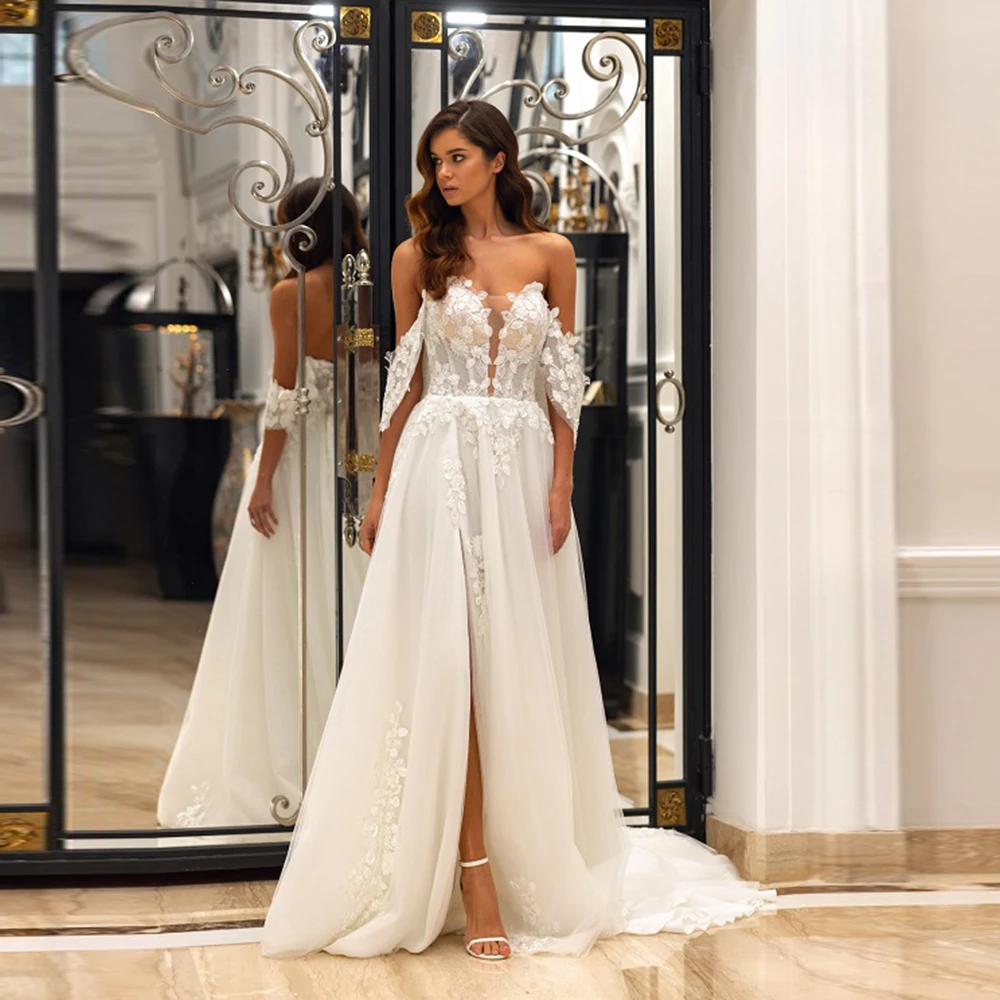 Customized Off-Shoulder Tulle Wedding Dress Appliques Lace High Slit Sweep Court Backless Wedding Gown
Customized Off-Shoulder Tulle Wedding Dress Appliques Lace High Slit Sweep Court Backless Wedding Gown