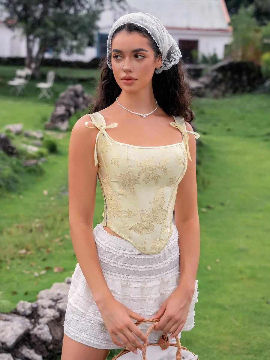 Elegant Sleeveless Corset Top With Floral Embroidery And Bow Straps For Women
Elegant Sleeveless Corset Top With Floral Embroidery And Bow Straps For Women