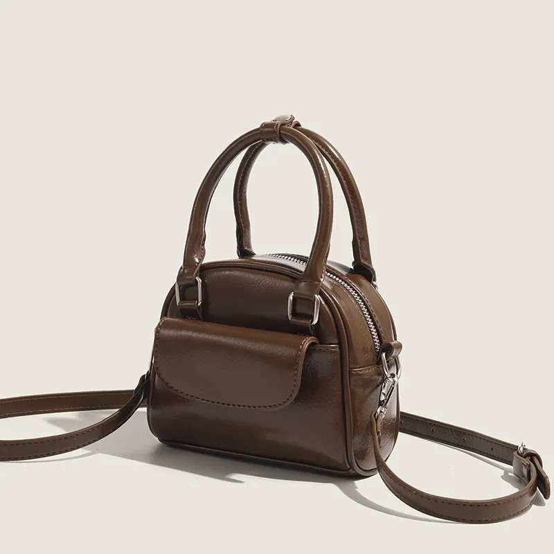 Korean niche design handbag 2025 new commuter handbag retro fashion crossbody shell bag for women
Korean niche design handbag 2025 new commuter handbag retro fashion crossbody shell bag for women