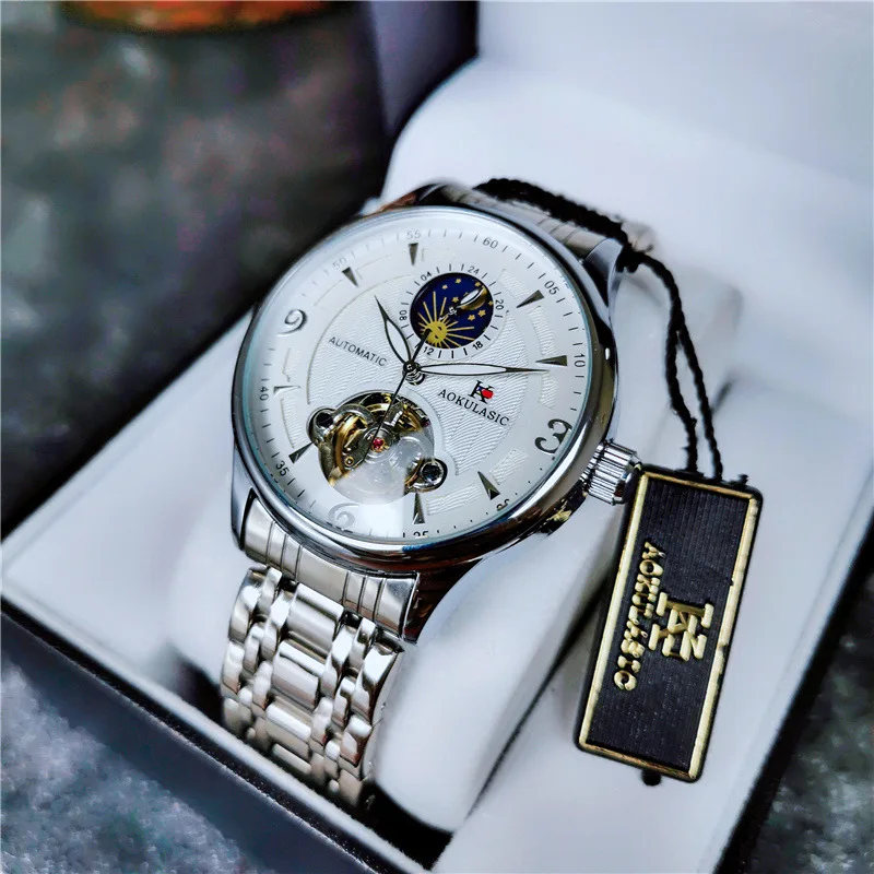 Stainless Steel New Four-Hands Moonphase Tourbillon Skeleton Luminous Waterproof Automatic Watch for Men
Stainless Steel New Four-Hands Moonphase Tourbillon Skeleton Luminous Waterproof Automatic Watch for Men