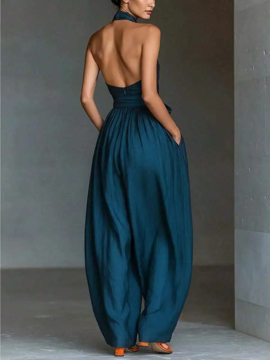 Teal Backless Halter Jumpsuit With gathered Waist And Oversized Wide-Leg Pants For Summer Casual Beach Or Evening Wear
Teal Backless Halter Jumpsuit With gathered Waist And Oversized Wide-Leg Pants For Summer Casual Beach Or Evening Wear