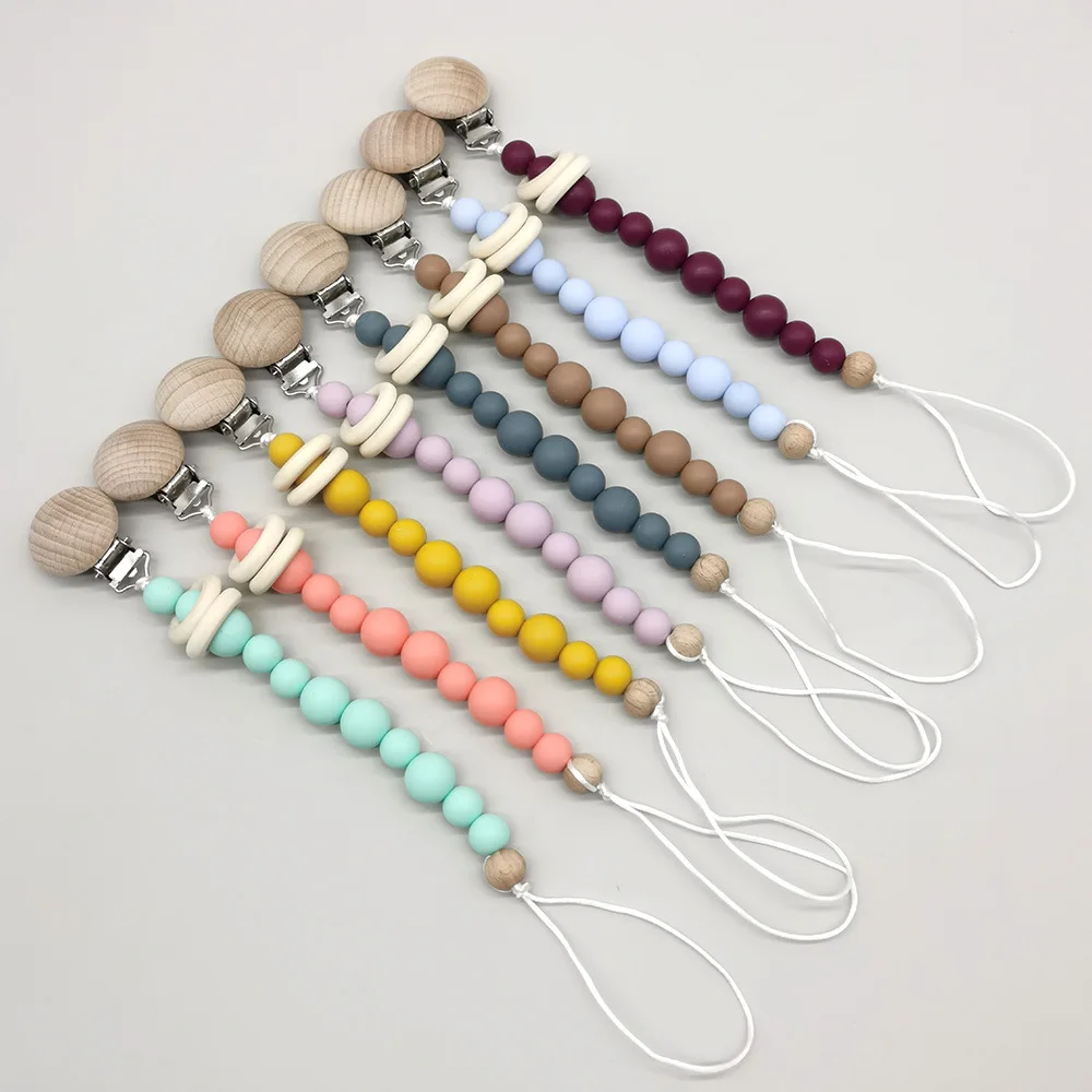 Baby Pacifier Clip Silicone Beads Bead Dummy Chain Holder Soother Chains Hemu Ring Beads wooden Clips Baby Teething Chew Toy
Baby Pacifier Clip Silicone Beads Bead Dummy Chain Holder Soother Chains Hemu Ring Beads wooden Clips Baby Teething Chew Toy