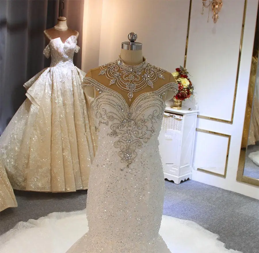 Luxury Crystal Beaded High Neck African Mermaid Wedding Dresses Sweep Lace Appliqued Plus Size Vestidos Noivas Bridal Gowns
Luxury Crystal Beaded High Neck African Mermaid Wedding Dresses Sweep Lace Appliqued Plus Size Vestidos Noivas Bridal Gowns