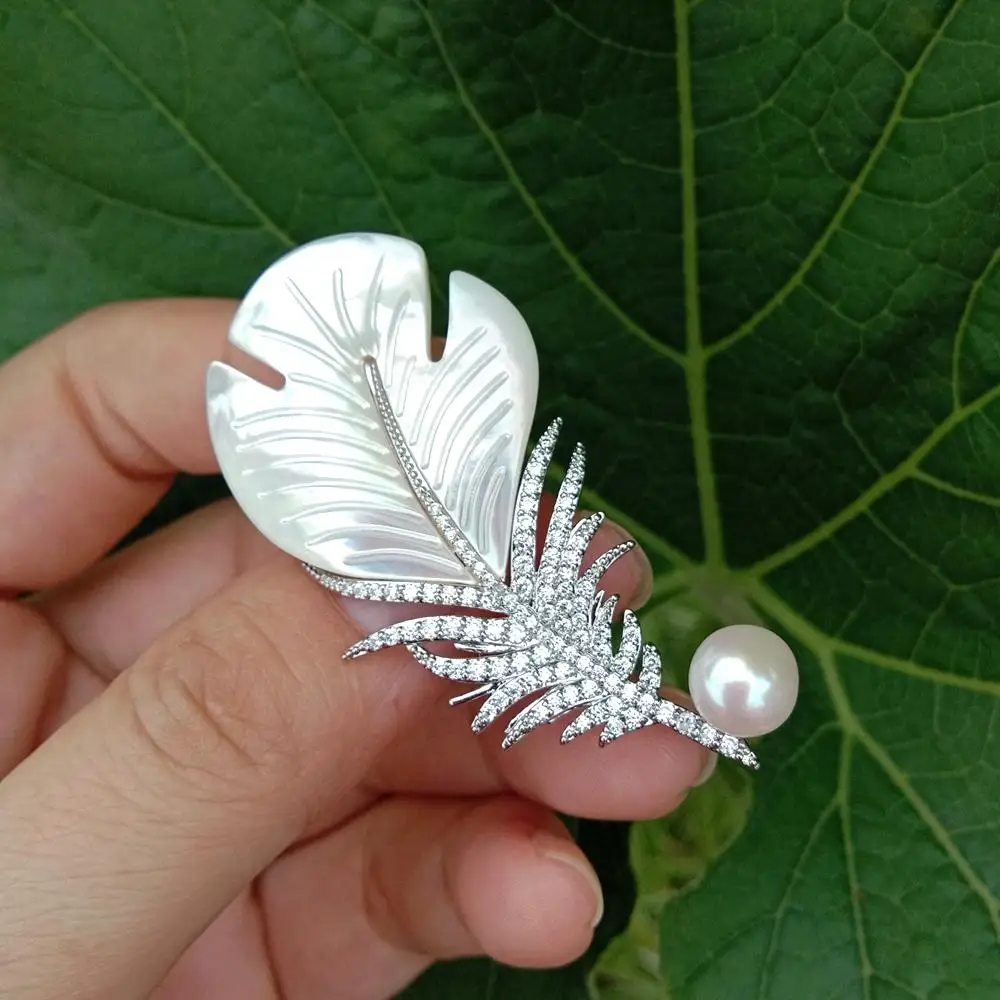 Y.YING Natural White Sea Shell Mop Carved Leather Shape Cz Pave White Pearl Brooch 
Y.YING Natural White Sea Shell Mop Carved Leather Shape Cz Pave White Pearl Brooch