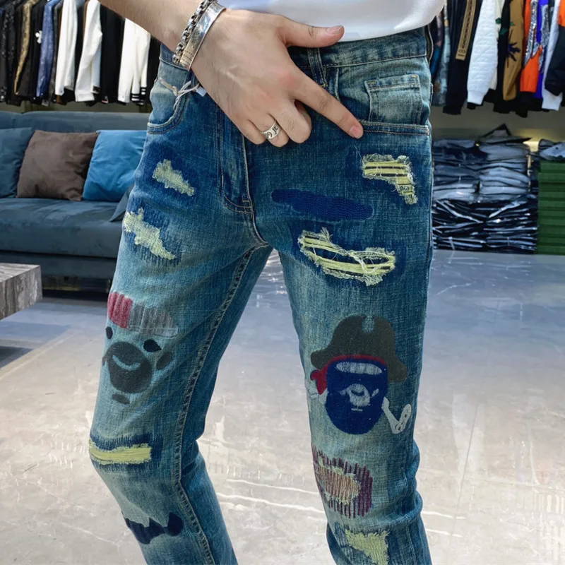 New European Style Fashion Personality Mens Abstract Art Print Denim Trousers Hole Patch Slim Fit Jeans Casual Men Jeans Hombre
New European Style Fashion Personality Mens Abstract Art Print Denim Trousers Hole Patch Slim Fit Jeans Casual Men Jeans Hombre