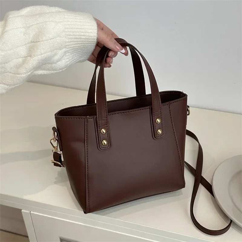 Solid color large capacity fashion shoulder messenger bag commuter tote bag
Solid color large capacity fashion shoulder messenger bag commuter tote bag