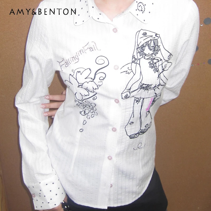Осенняя новая белая женская рубашка с длинным рукавом с мультяшным принтом, японский дизайн, универсальные рубашки с лацканами в горошек для похудения, женская куртка 
Осенняя новая белая женская рубашка с длинным рукавом с мультяшным принтом, японский дизайн, универсальные рубашки с лацканами в горошек для похудения, женская куртка