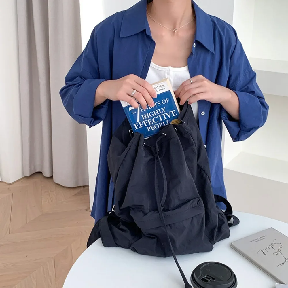 Japanese Harajuku Lightweight Backpack Casual Fashion Drawstring Student School Backpack Y2K Simple High Capacity Nylon Book Bag
Japanese Harajuku Lightweight Backpack Casual Fashion Drawstring Student School Backpack Y2K Simple High Capacity Nylon Book Bag