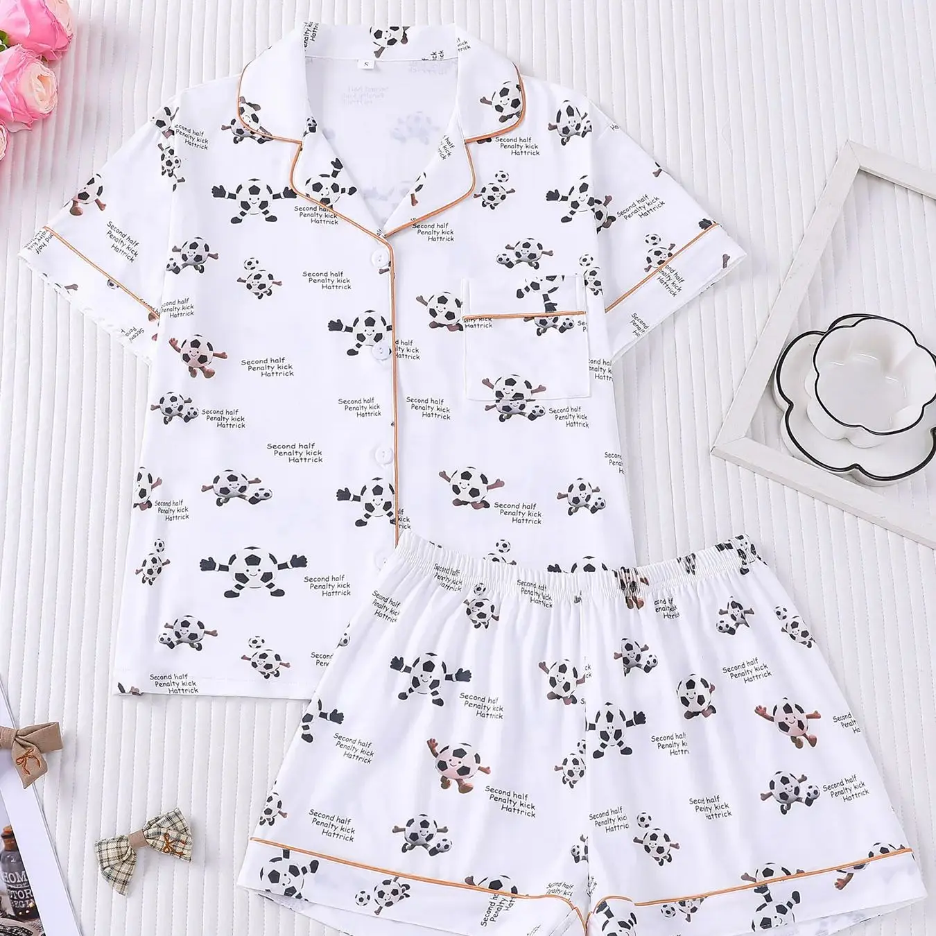 Skin friendly breathable football printed themed pajamas set for women, short sleeved cardigan shorts can be worn as outerwear
Skin friendly breathable football printed themed pajamas set for women, short sleeved cardigan shorts can be worn as outerwear