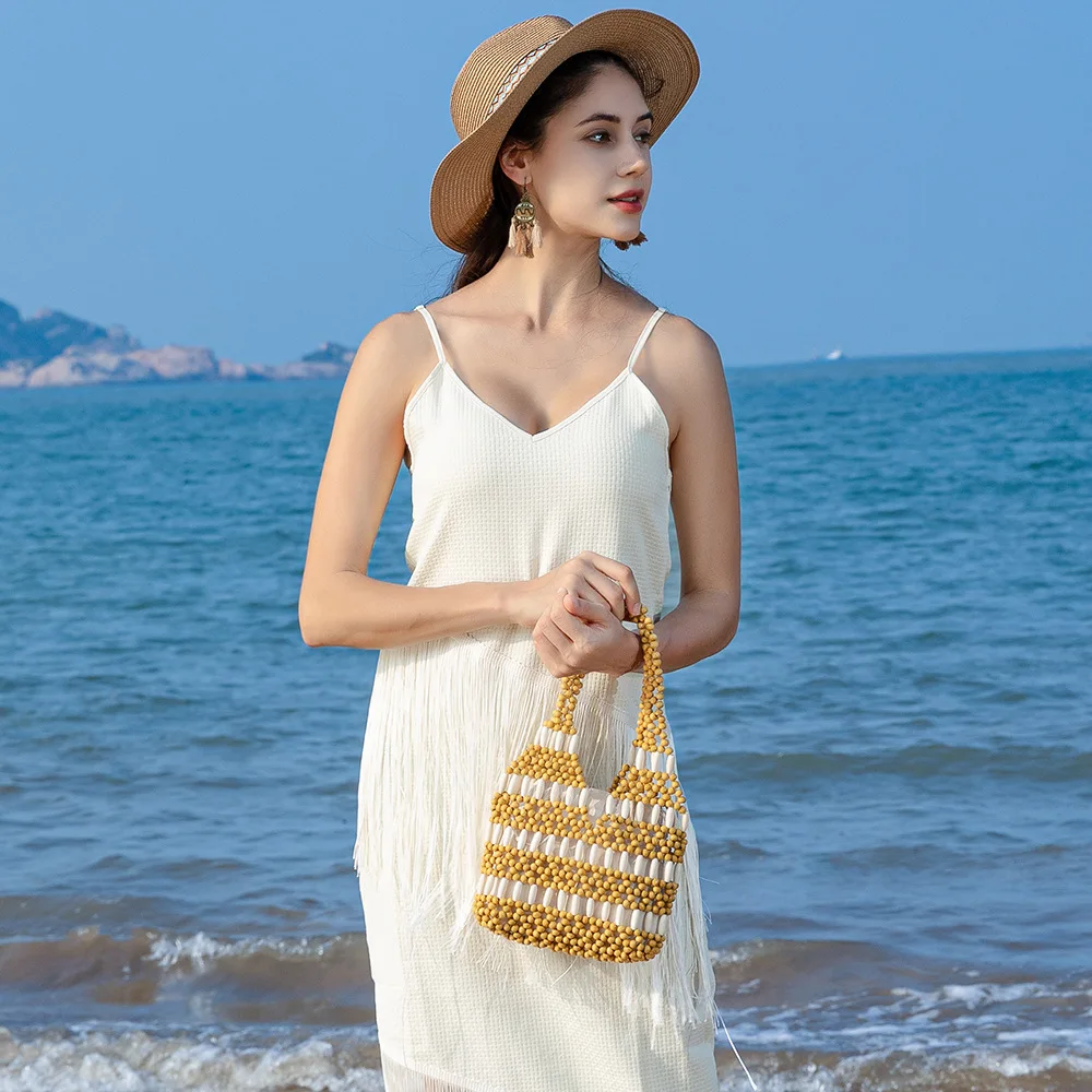 Handcrafted Hollow Wooden Bead Bag Handheld Contrast Color Weaving Bags for Ladies Beach Vacation Cross-Border Style Medium Size
Handcrafted Hollow Wooden Bead Bag Handheld Contrast Color Weaving Bags for Ladies Beach Vacation Cross-Border Style Medium Size