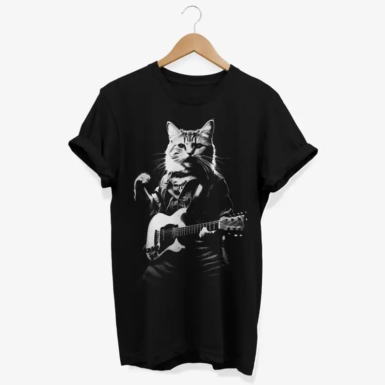 Camiseta con gato tocando la guitarra: divertida camiseta con gráficos felinos rockeros
Camiseta con gato tocando la guitarra: divertida camiseta con gráficos felinos rockeros