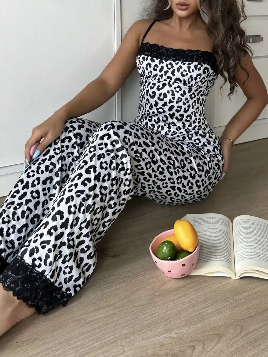 White Leopard Print Women’s Satin Pajama Set With Black Lace Trim On Strappy Top And Wide-Leg Pants
White Leopard Print Women’s Satin Pajama Set With Black Lace Trim On Strappy Top And Wide-Leg Pants