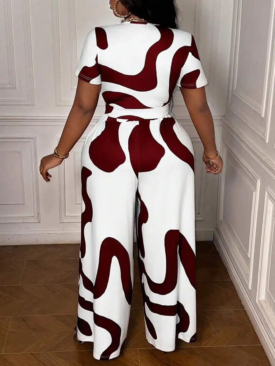 Women Plus Size Printed Short Sleeve Top And Wide Leg Pants Set
Women Plus Size Printed Short Sleeve Top And Wide Leg Pants Set