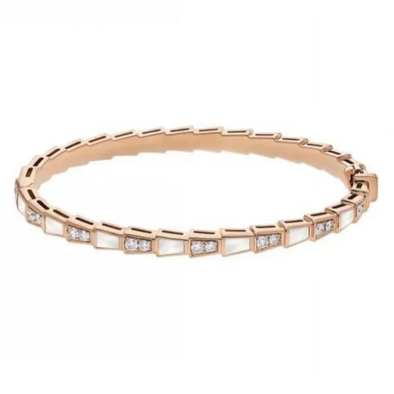 Rose Gold-Plated Geometric Bangle with Alternating Mother-of-Pearl and Pavé Diamond Links
Rose Gold-Plated Geometric Bangle with Alternating Mother-of-Pearl and Pavé Diamond Links