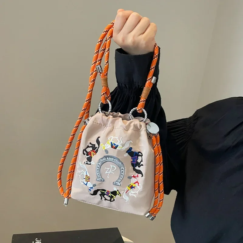 Embroidered Ins Bucket Small Cloth Bag for Women Simple Contrasting Color Outdoor Walking Single Shoulder Crossbody Phone Bag
Embroidered Ins Bucket Small Cloth Bag for Women Simple Contrasting Color Outdoor Walking Single Shoulder Crossbody Phone Bag