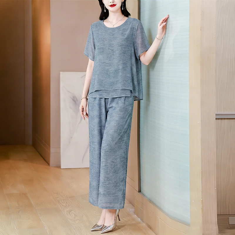 Elegant Large Size Women's Fashion 2026 Summer New Chiffon Short Sleeve Top Wide Leg Pants Two Piece Set New Chinese Style
Elegant Large Size Women's Fashion 2026 Summer New Chiffon Short Sleeve Top Wide Leg Pants Two Piece Set New Chinese Style
