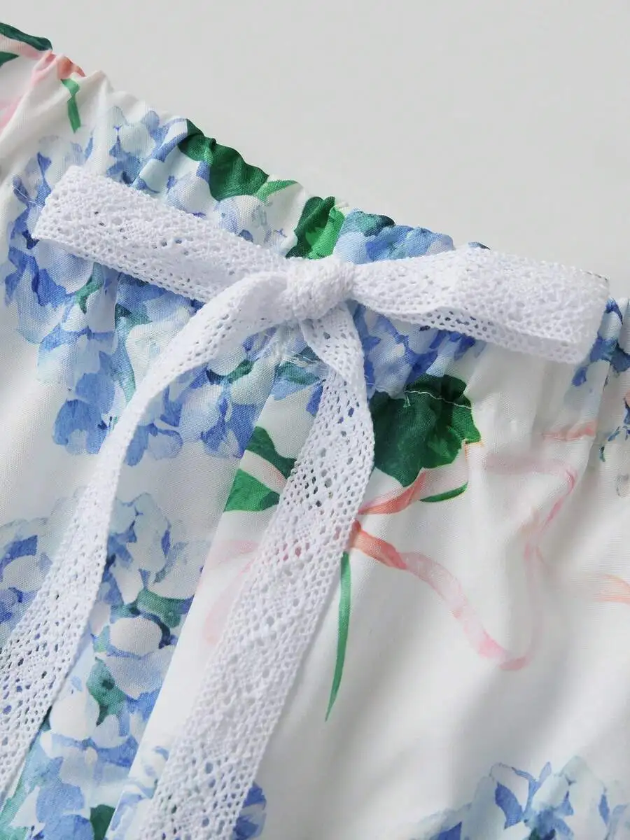 Women Floral Sleepwear Set With Lace Bow Tie Sleeveless Smocked Crop Top And Ruffle Boxer Shorts
Women Floral Sleepwear Set With Lace Bow Tie Sleeveless Smocked Crop Top And Ruffle Boxer Shorts