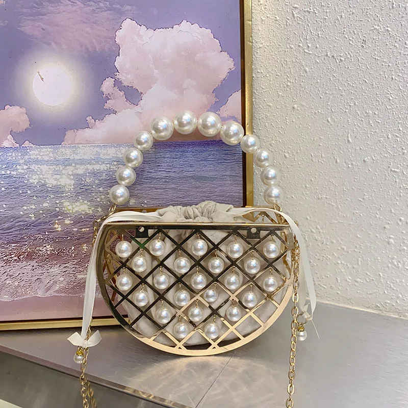 2025 New Vintage French Style Hollow Out Bird Cage Handbags Pearl Clutch Purse Women's Evening Bag Soft Handle Versatile Design
2025 New Vintage French Style Hollow Out Bird Cage Handbags Pearl Clutch Purse Women's Evening Bag Soft Handle Versatile Design
