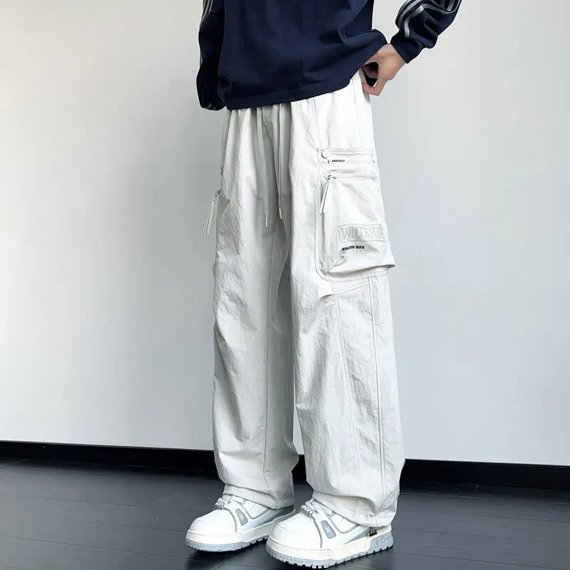 Men's Casual Pants 2025 Spring Autumn Streetwear Loose Drawstring Joggers Outdoor Cargo Full-Length Pants Youth Solid Trousers
Men's Casual Pants 2025 Spring Autumn Streetwear Loose Drawstring Joggers Outdoor Cargo Full-Length Pants Youth Solid Trousers