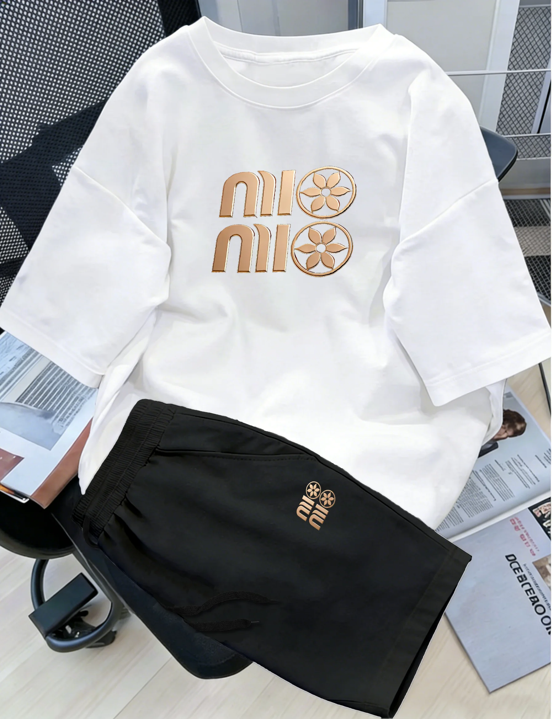 Men's Summer Casual Comfort Two-Piece Set – Crew Neck T-Shirt & Elastic Waist Drawstring Shorts with Metallic Geometric Lette
Men's Summer Casual Comfort Two-Piece Set – Crew Neck T-Shirt & Elastic Waist Drawstring Shorts with Metallic Geometric Lette