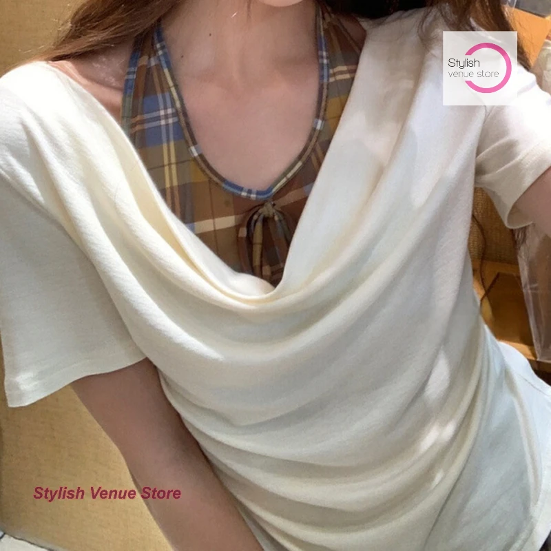 Design sense plaid stitching fake two-piece short-sleeved T-shirt female summer fashion Joker unique beautiful shoulder blouse.
Design sense plaid stitching fake two-piece short-sleeved T-shirt female summer fashion Joker unique beautiful shoulder blouse.