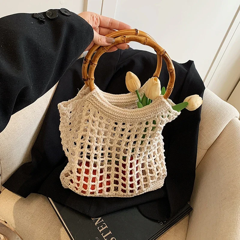 Vintage Bamboo Handle Tote Bohemian Hollow Out Handbag Fashion Cotton Fabric Knitting Women Bag 2025 Summer Shopping Bag
Vintage Bamboo Handle Tote Bohemian Hollow Out Handbag Fashion Cotton Fabric Knitting Women Bag 2025 Summer Shopping Bag
