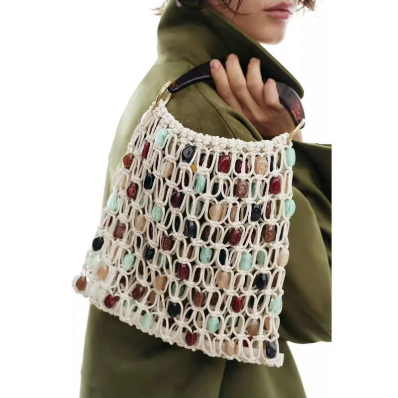 New hand-woven beaded handbag, summer niche hollow mesh beach vacation bag
New hand-woven beaded handbag, summer niche hollow mesh beach vacation bag