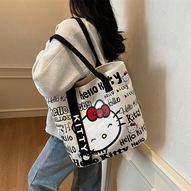 Новинка 2025 года, холщовая сумка Hello Kitty, повседневная модная женская сумка-тоут большой вместимости, студенческая сумка на одно плечо с героями мультфильмов, пригородная сумка
Новинка 2025 года, холщовая сумка Hello Kitty, повседневная модная женская сумка-тоут большой вместимости, студенческая сумка на одно плечо с героями мультфильмов, пригородная сумка