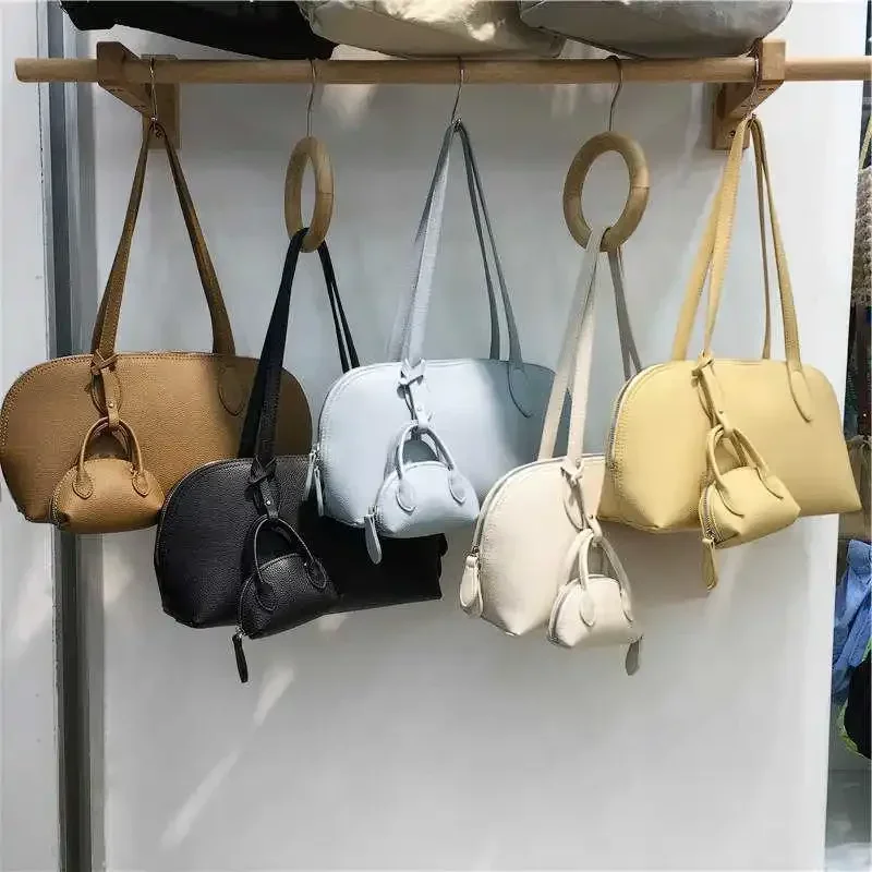 Корейские новые женские сумки на плечо 2025, простые универсальные сумки из искусственной кожи под мышками с кошельком для монет, женские мягкие сумки
Корейские новые женские сумки на плечо 2025, простые универсальные сумки из искусственной кожи под мышками с кошельком для монет, женские мягкие сумки