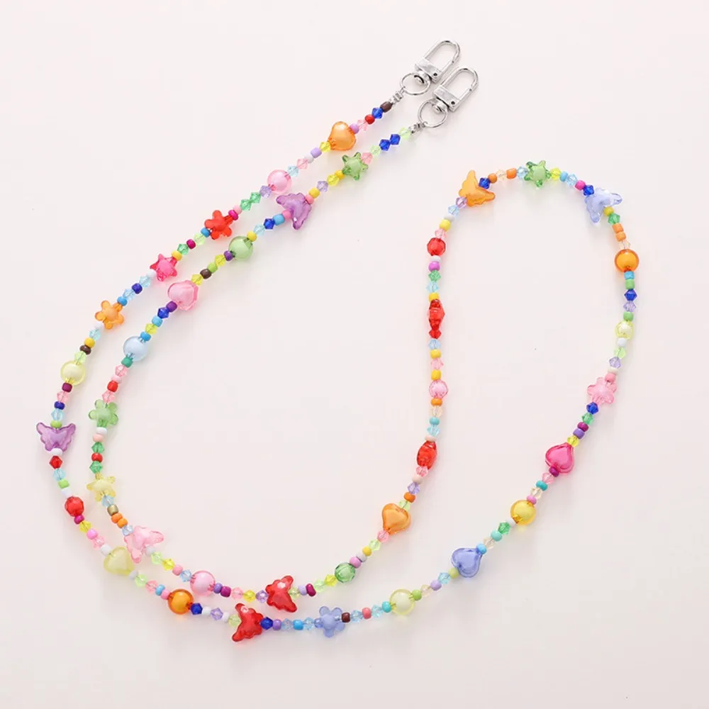 Ремешок для мобильного телефона ярких цветов, цепочка через плечо с бисером, бабочка, цветок, ремешок через плечо для мобильного телефона, маленький медвежонок, защита от потери
Ремешок для мобильного телефона ярких цветов, цепочка через плечо с бисером, бабочка, цветок, ремешок через плечо для мобильного телефона, маленький медвежонок, защита от потери