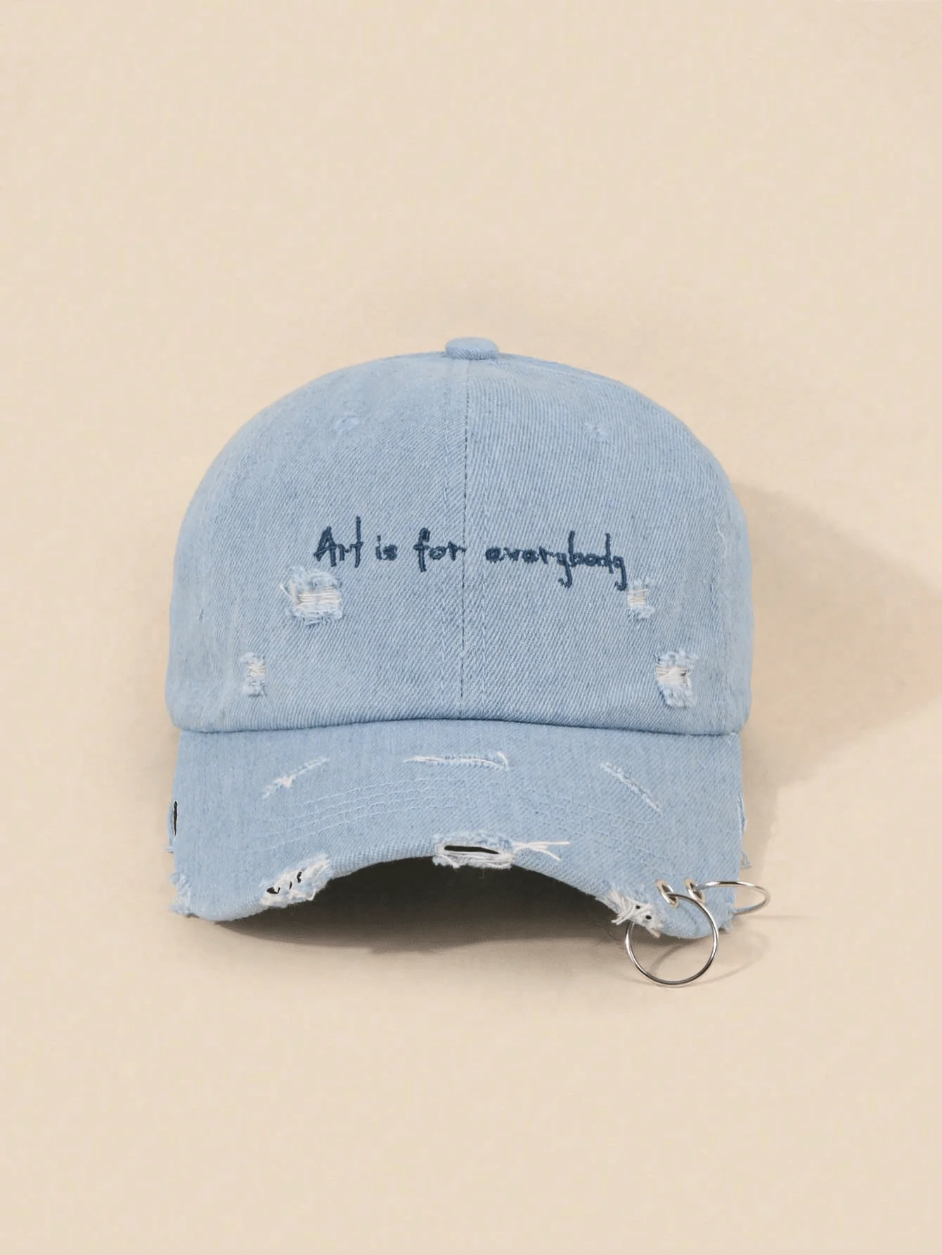 Регулируемая бейсболка Art Is For Everybody из потертого денима с металлическим кольцом
Регулируемая бейсболка Art Is For Everybody из потертого денима с металлическим кольцом