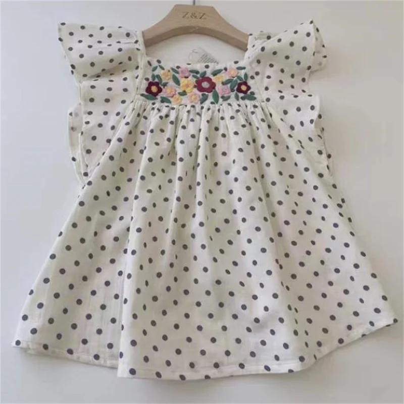 New children's flying sleeve top polka dot flower white embroidery flower top cotton linen shirt
New children's flying sleeve top polka dot flower white embroidery flower top cotton linen shirt