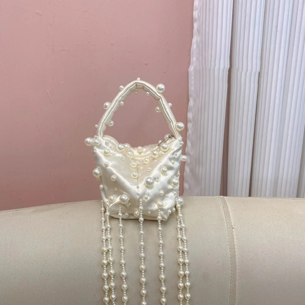 New Chinese Style Retro Weaving Beaded Irregular Pearl Tassel Satin Handheld Bag Gentle Elegant Temperament Party Clutch Bag
New Chinese Style Retro Weaving Beaded Irregular Pearl Tassel Satin Handheld Bag Gentle Elegant Temperament Party Clutch Bag
