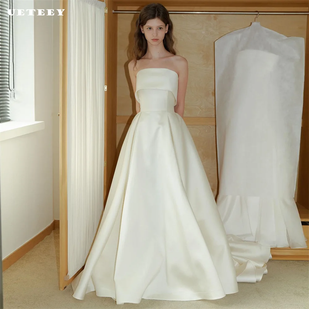 UETEEY Customized Simple Strapless Sleeveless Wedding Dress For Women Elegant Satin A Line Lace Up Back Floor Length Bridal Gown
UETEEY Customized Simple Strapless Sleeveless Wedding Dress For Women Elegant Satin A Line Lace Up Back Floor Length Bridal Gown