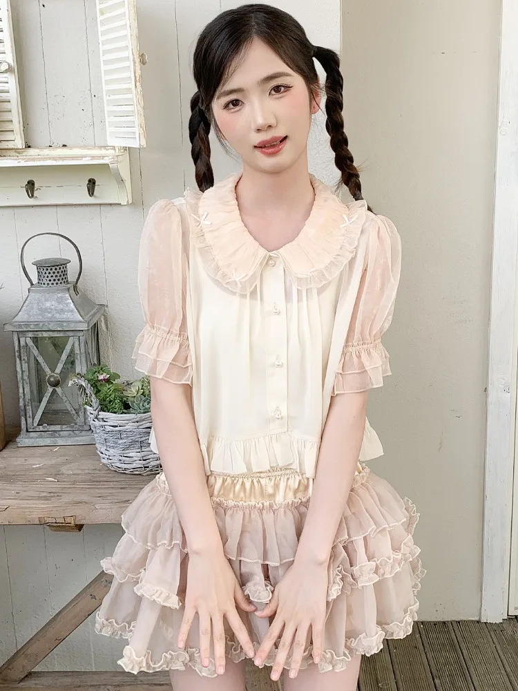 Sweet Ruffles Peter Pan Collar Lolita Shirt Women Summer Puff Sleeve Blusas Mujer 2025 New Single Breasted Cardigan Blouses
Sweet Ruffles Peter Pan Collar Lolita Shirt Women Summer Puff Sleeve Blusas Mujer 2025 New Single Breasted Cardigan Blouses