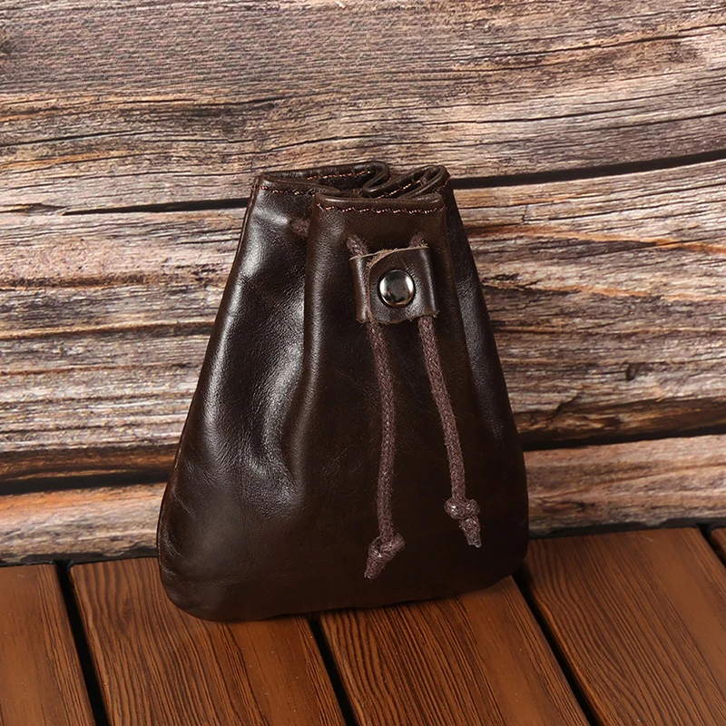New leather mini retro small purse for coins and headphones. Leather drawstring mini purse with trendy style.
New leather mini retro small purse for coins and headphones. Leather drawstring mini purse with trendy style.