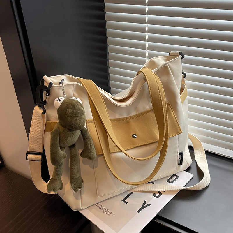 Large-capacity Japanese Canvas Commuter Bag Female 2023 New Casual Simple One-shoulder Messenger Bag Tote Class Bag
Large-capacity Japanese Canvas Commuter Bag Female 2023 New Casual Simple One-shoulder Messenger Bag Tote Class Bag