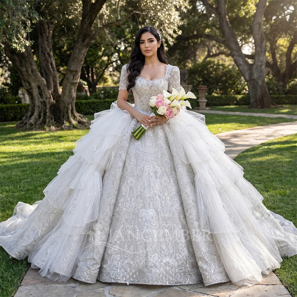 Elegant Shiny Wedding Dress Ball Gowns Customized Glitter Tulle Square Collar Pleat Bride Dresses Wedding Gowns فساتين ح
Elegant Shiny Wedding Dress Ball Gowns Customized Glitter Tulle Square Collar Pleat Bride Dresses Wedding Gowns فساتين ح