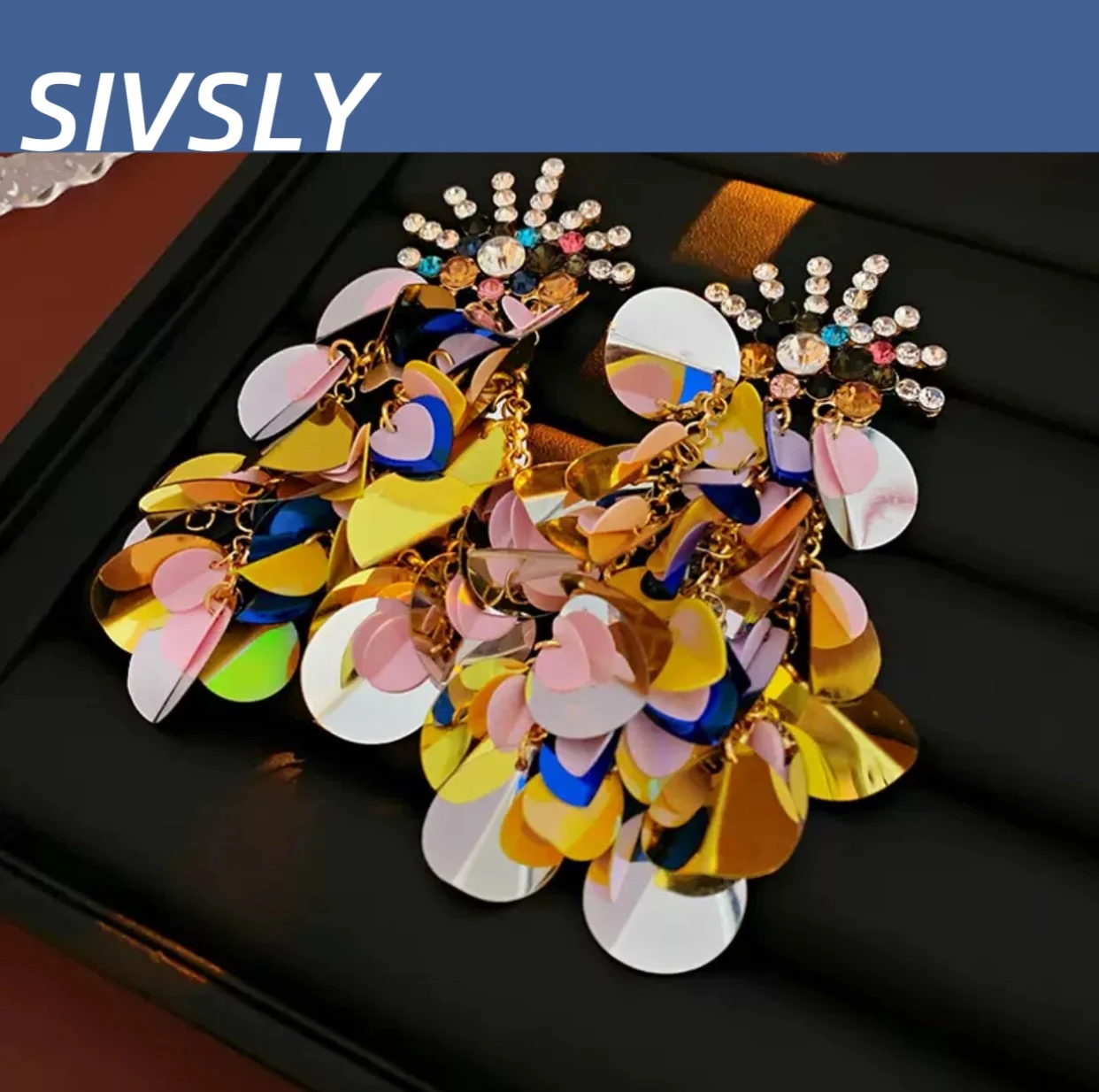 Shimmering earrings, vacation-inspired design, high-end texture, vintage aesthetic style, long-length, extravagant and bold 
Shimmering earrings, vacation-inspired design, high-end texture, vintage aesthetic style, long-length, extravagant and bold