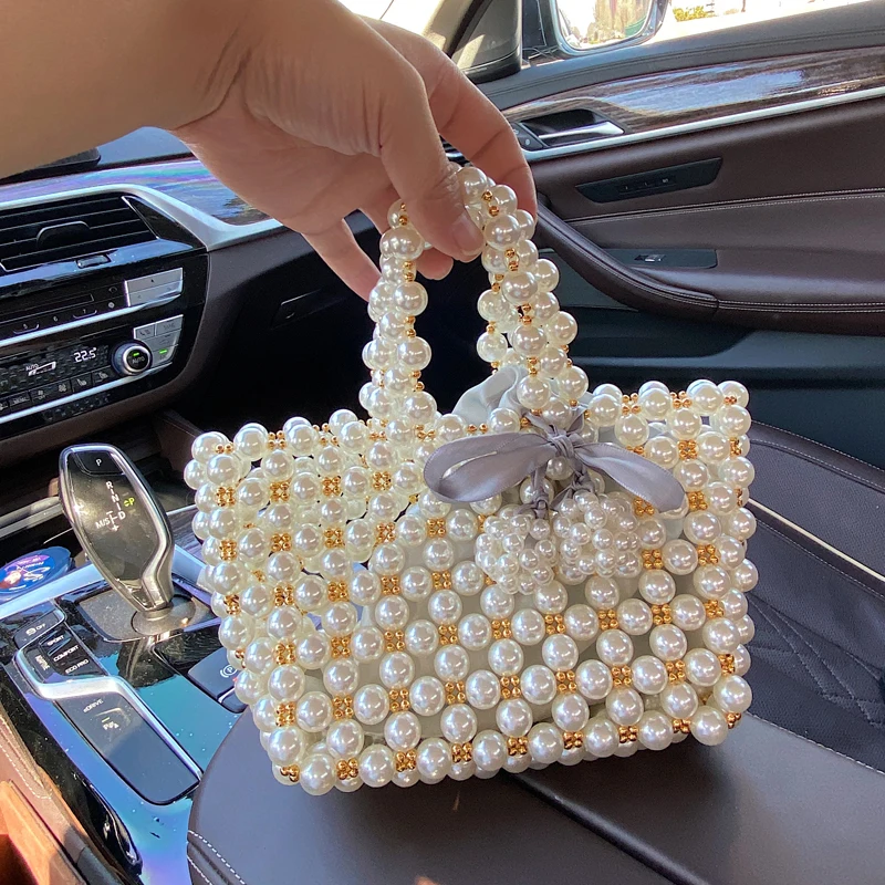 New Handmade Pearl Fragrance Wind Handbag Universal II Women's Bag Woven Mobile Phone Bag Soft British Style Fashion Accessories
New Handmade Pearl Fragrance Wind Handbag Universal II Women's Bag Woven Mobile Phone Bag Soft British Style Fashion Accessories