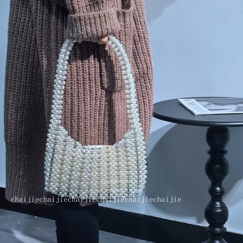 New Ins Fashion Simple Pearl Handwoven Handheld Handheld Women's Shoulder Bag Vintage Elegant High Quality Handbags for Woman
New Ins Fashion Simple Pearl Handwoven Handheld Handheld Women's Shoulder Bag Vintage Elegant High Quality Handbags for Woman