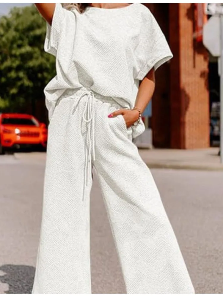 Summer Women's Suit Fashion Solid Color Two Piece Set Casual Loose V Neck Top And Loose Wide Legs Trousers Set 2025 Sportswear
Summer Women's Suit Fashion Solid Color Two Piece Set Casual Loose V Neck Top And Loose Wide Legs Trousers Set 2025 Sportswear