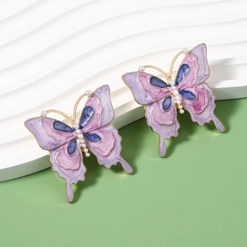 New Fashion Light Luxury Niche Design Insect Butterfly Alloy Dripping Oil Imitation Pearl Stud Earrings Female
New Fashion Light Luxury Niche Design Insect Butterfly Alloy Dripping Oil Imitation Pearl Stud Earrings Female