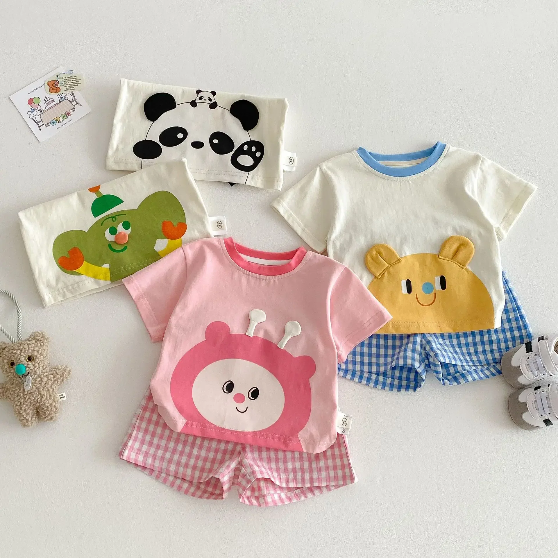 Children's Cartoon Set 2025 New Summer Girls' Elegant Short Sleeved T-shirt Thin Boys' Checkered Shorts Two Piece Set
Children's Cartoon Set 2025 New Summer Girls' Elegant Short Sleeved T-shirt Thin Boys' Checkered Shorts Two Piece Set