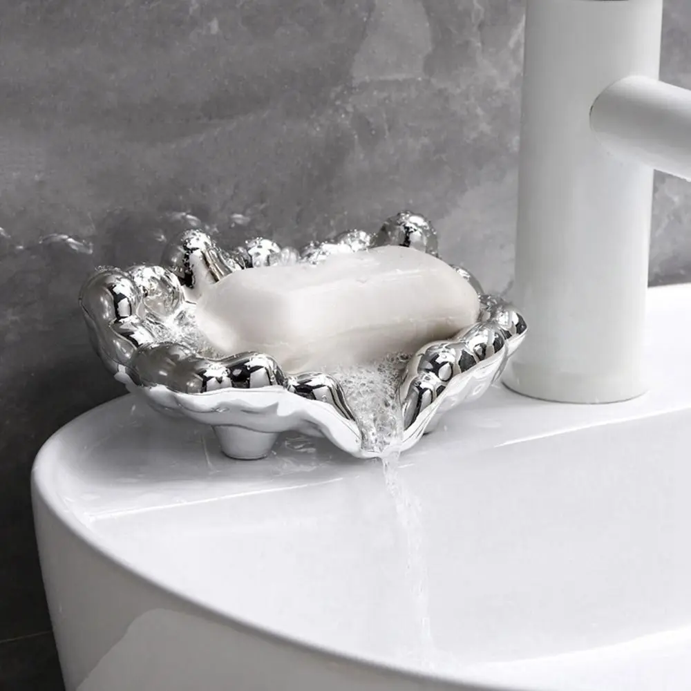 Элегантная пластиковая мыльница в форме золотого облака, самодренирующаяся, серебристый органайзер для мыла в ванную комнату
Элегантная пластиковая мыльница в форме золотого облака, самодренирующаяся, серебристый органайзер для мыла в ванную комнату