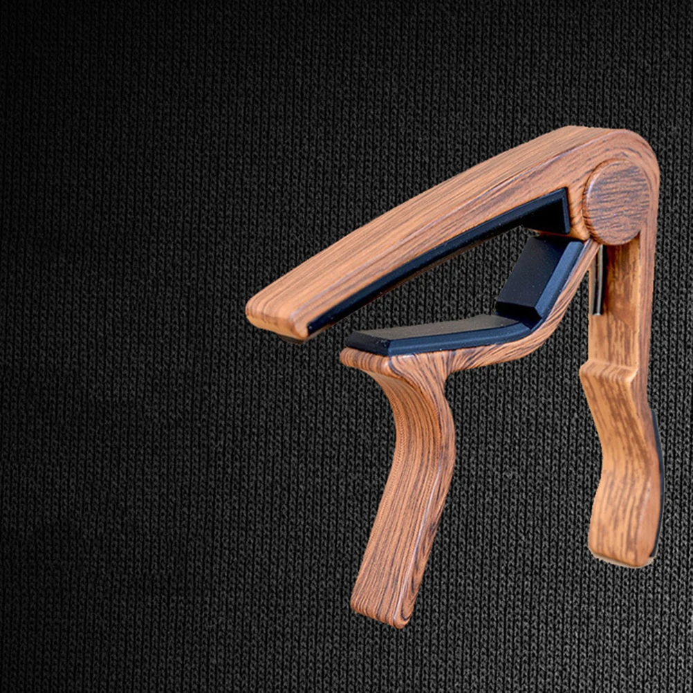 1pcs Rosewood Guitar Capo Key Fast Release Tuning Stabilizer Durable Folk Guitar Ukulele Violin Bass Accessory
1pcs Rosewood Guitar Capo Key Fast Release Tuning Stabilizer Durable Folk Guitar Ukulele Violin Bass Accessory