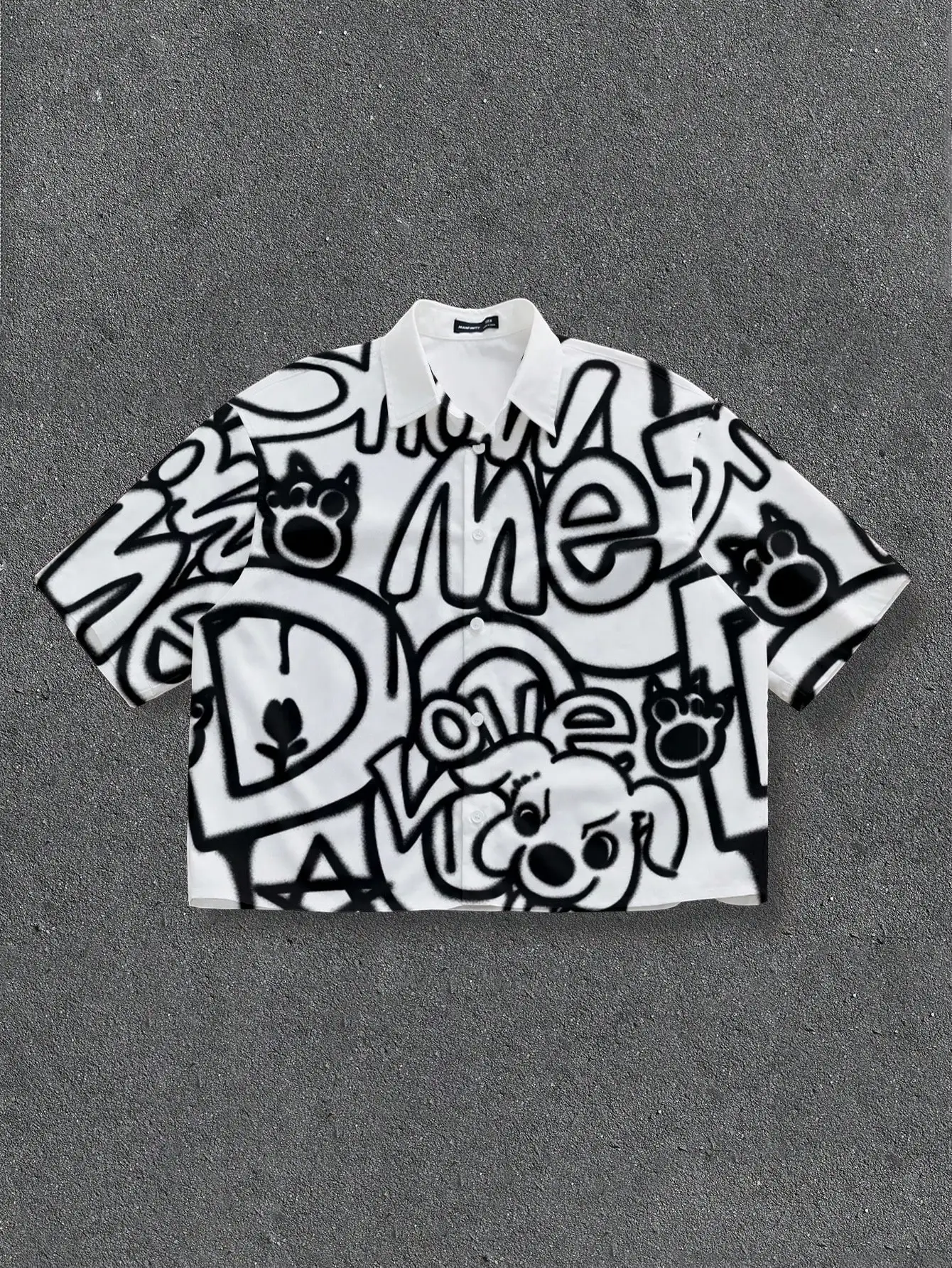Oversized White Short Sleeve Shirt with Black Graffiti Print and Cartoon Dog Motif
Oversized White Short Sleeve Shirt with Black Graffiti Print and Cartoon Dog Motif