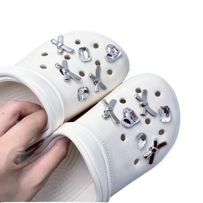 New DIY Stylish Silver Bow Hole Shoe Charms for Clogs Slides Sandals Garden Shoes Decorations Charm Set Accessories Kids Gifts
New DIY Stylish Silver Bow Hole Shoe Charms for Clogs Slides Sandals Garden Shoes Decorations Charm Set Accessories Kids Gifts