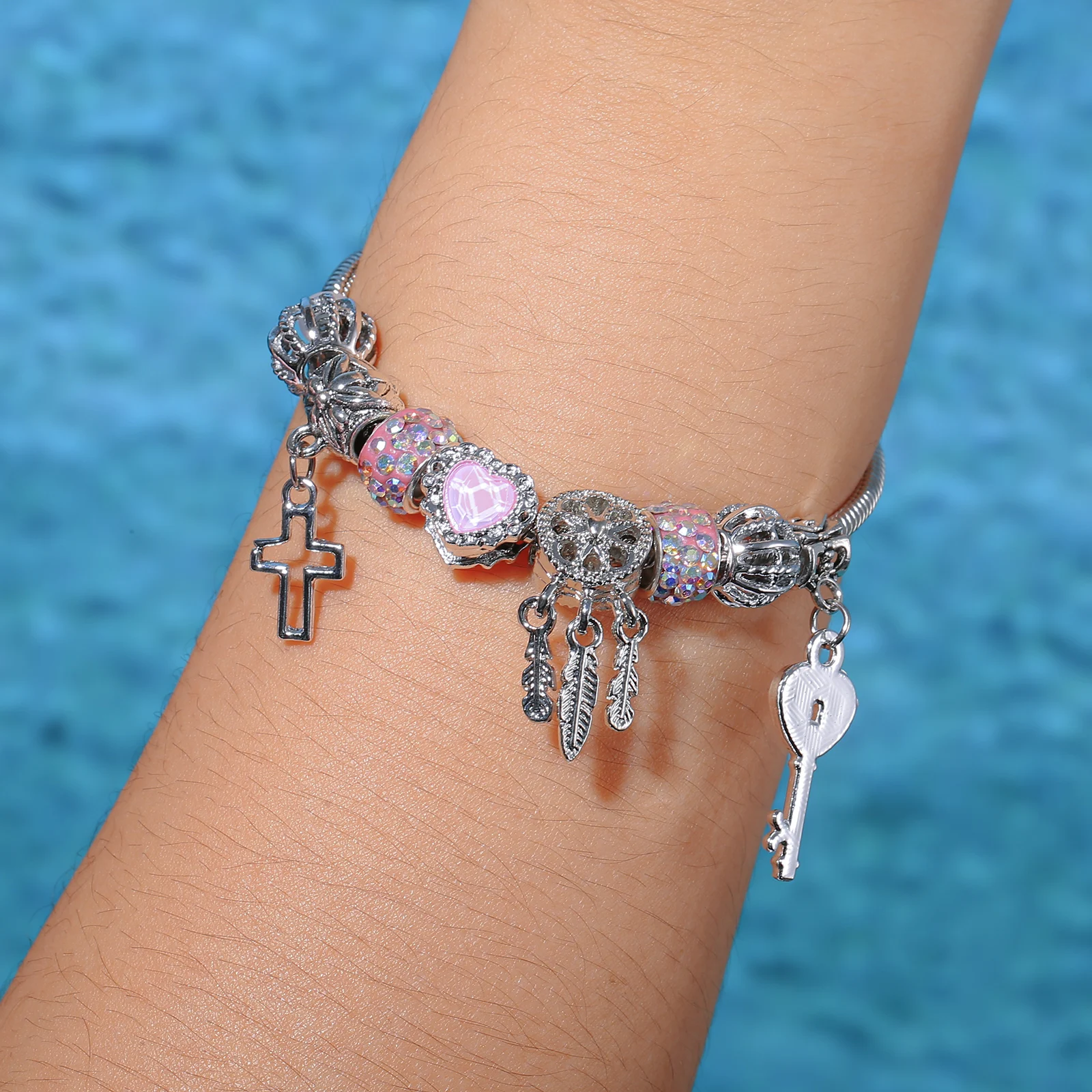 Silvery Stainless Steel Charm Bracelet with Heart Lock and Cross Pendants for Women
Silvery Stainless Steel Charm Bracelet with Heart Lock and Cross Pendants for Women